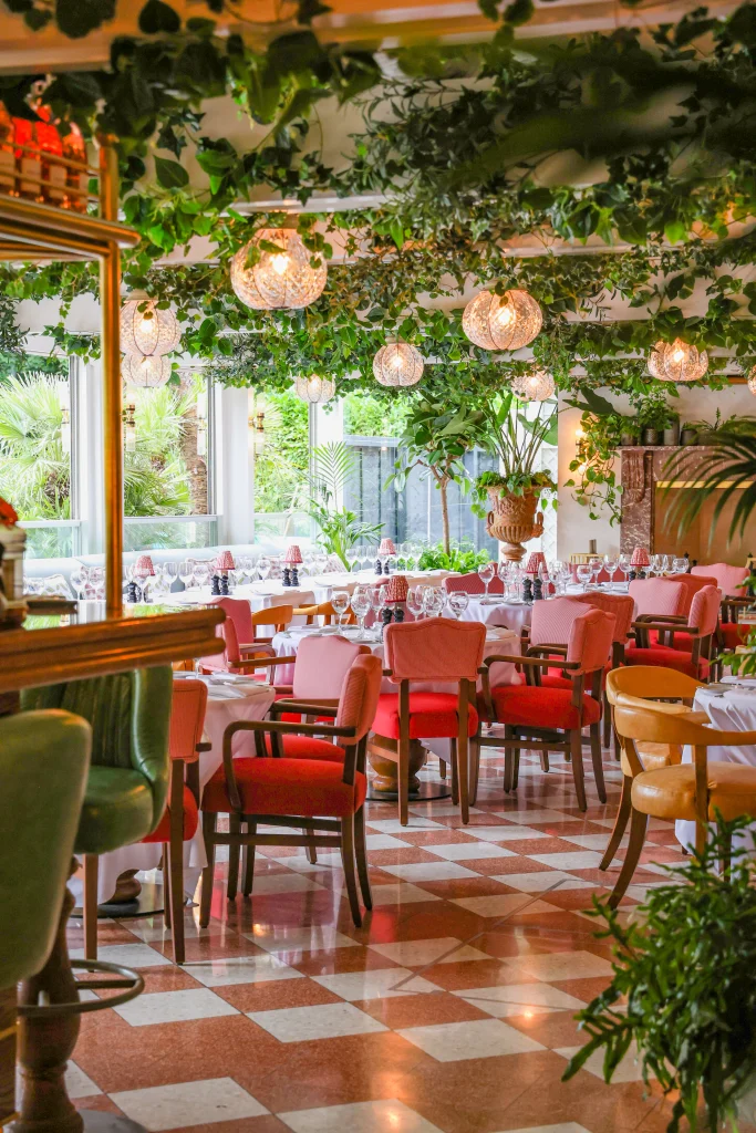 San Carlo Alderley Edge restaurant with ceiling mounted artificial foliage and live plants in aged terracotta urns
