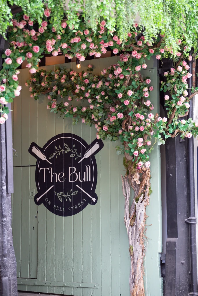 The Bull Henley with artificial blossom tree curving around entrance