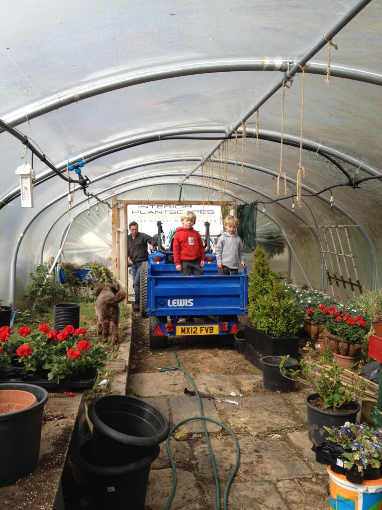 Richard and sons with Interior Plantscapes logo in background