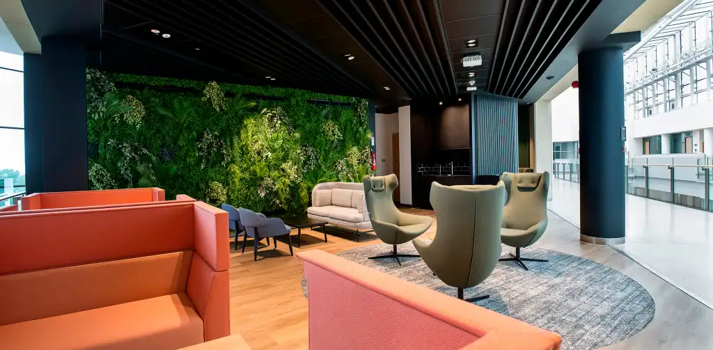 Alderley park leisure area with artificial living wall backdrop by i want plants