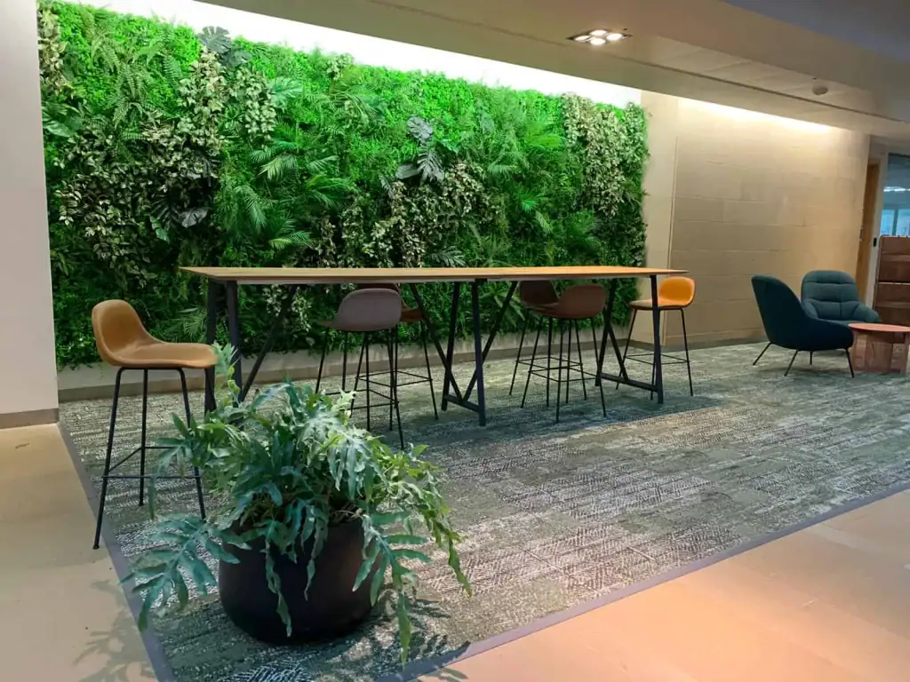 Artificial green living wall with extra Tradescantia, Forest Fern, Mostera, Pathos and Areca Palm