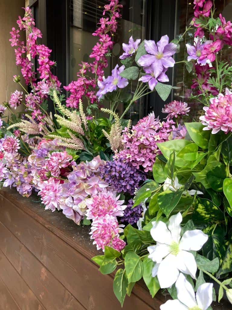 Close-up of pink, purple and white floral installation at All Bar One
