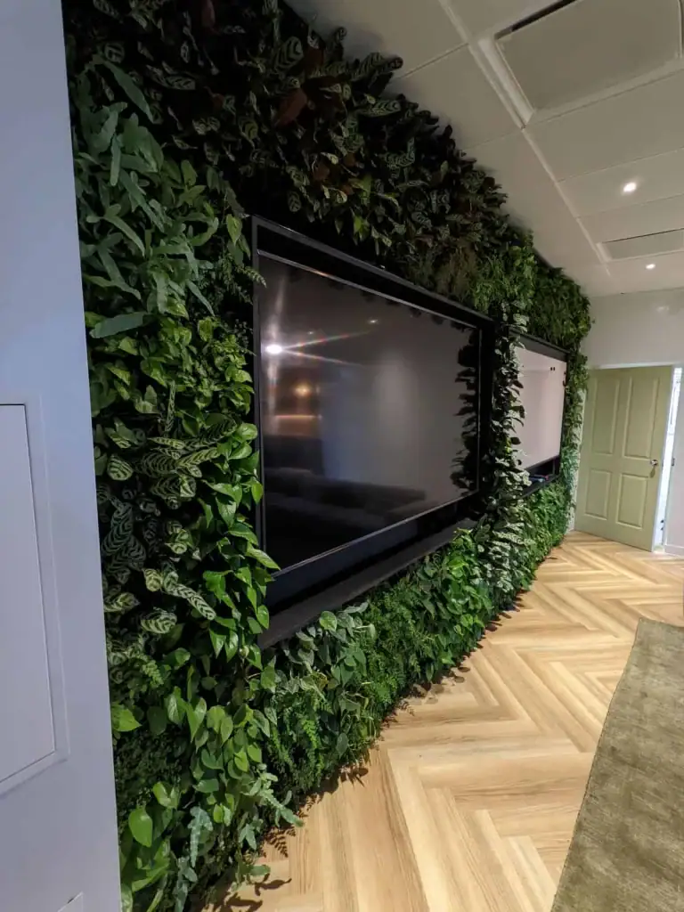 Auto Trader Manchester HYVERT living wall within meeting room with inset white board and media screen