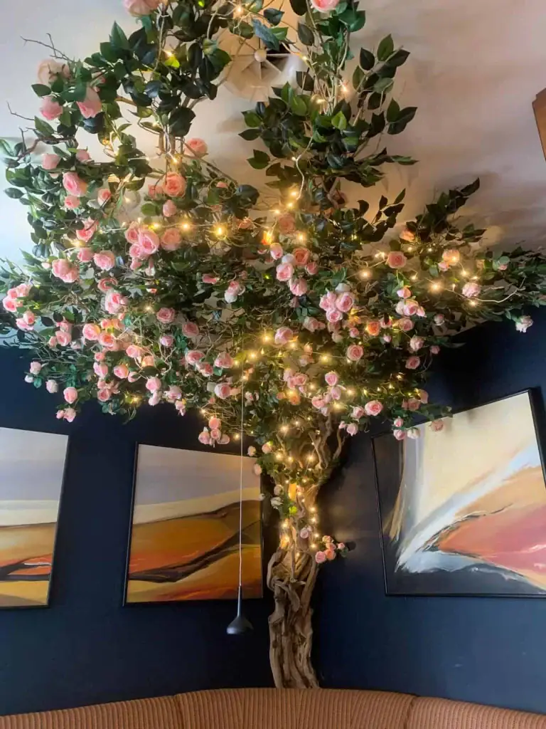 Bespoke tree with pale pink roses and Bougainvillea at The Club, Jersey