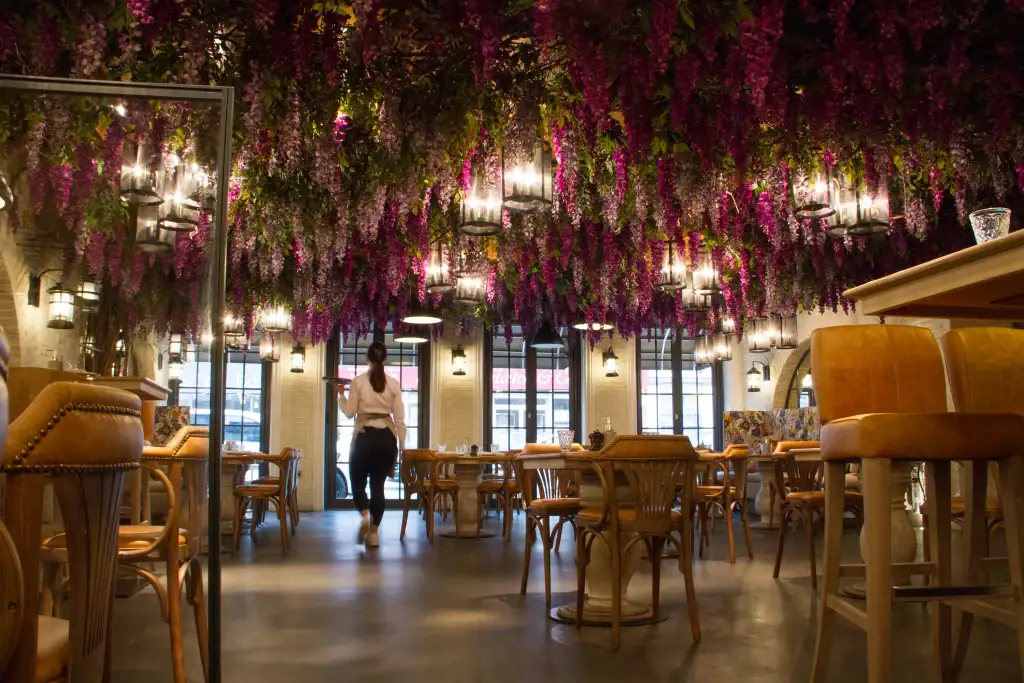 Victors Restaurant Hale with ceiling suspended artificial Wisteria blossom by I Want Plants