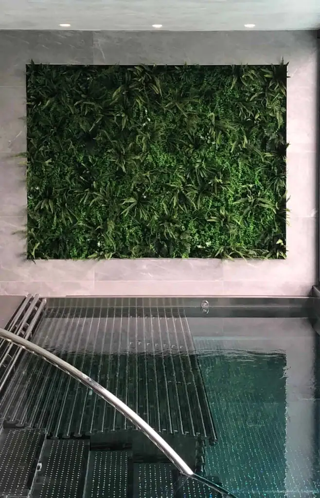 Artificial green wall installation in swimming pool area