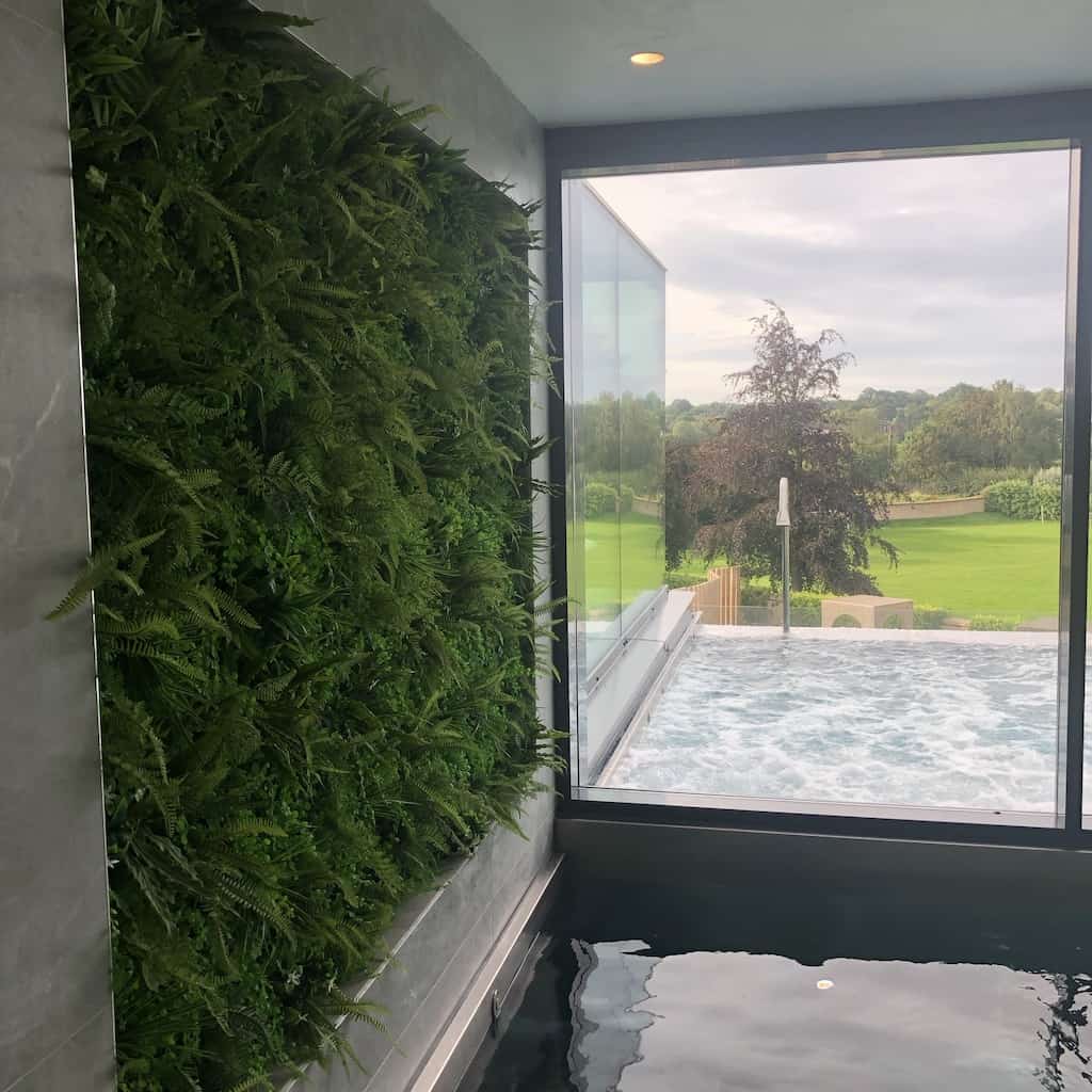 Green wall in a private leisure and pool setting