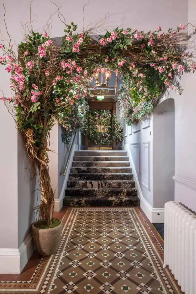 Willow and pink rambling rose foliage half arch at Lost and Founds Leeds by I Want Plants