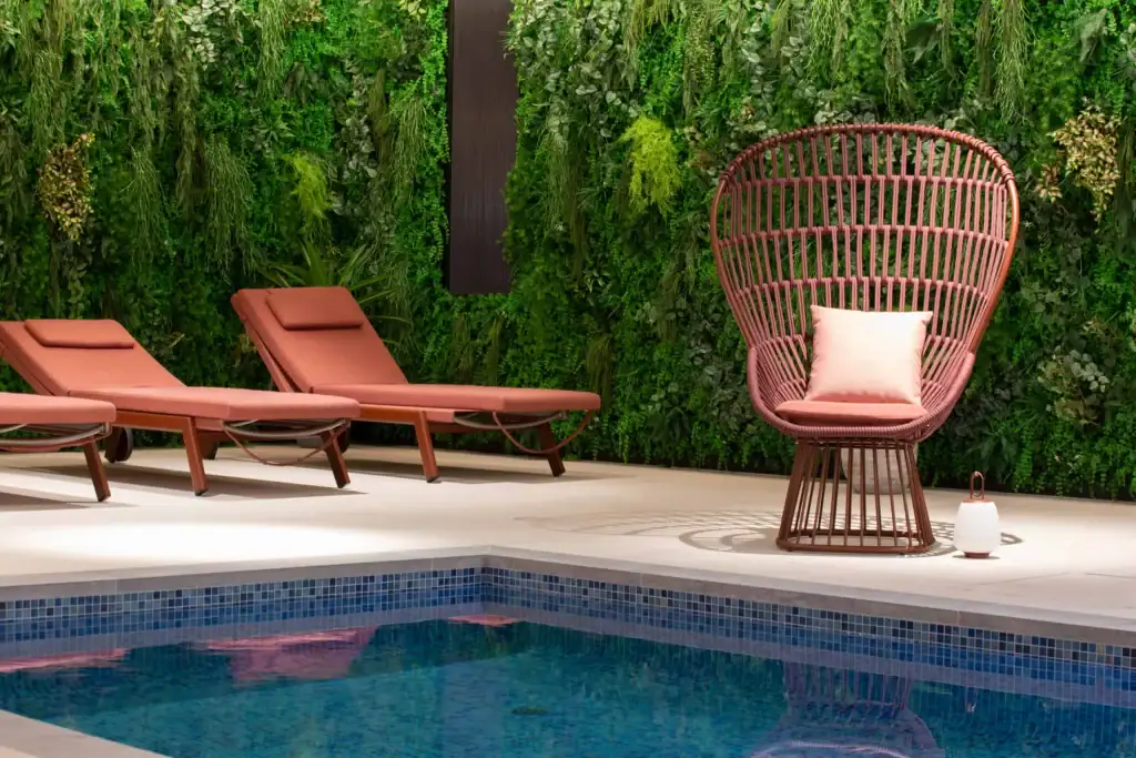 artificial living wall within interior swimming pool area by I Want Plants