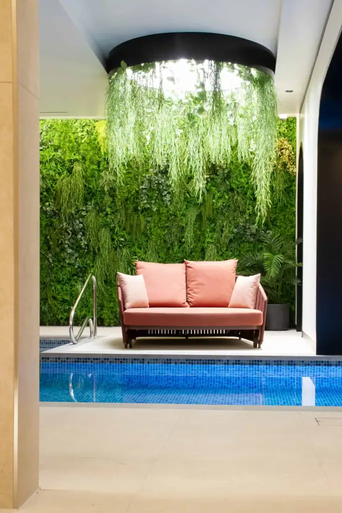 Oxygen Manchester Residents Pool with artificial bean spray foliage attached to hoops and suspended from ceiling and artificial living wall by I Want Plants