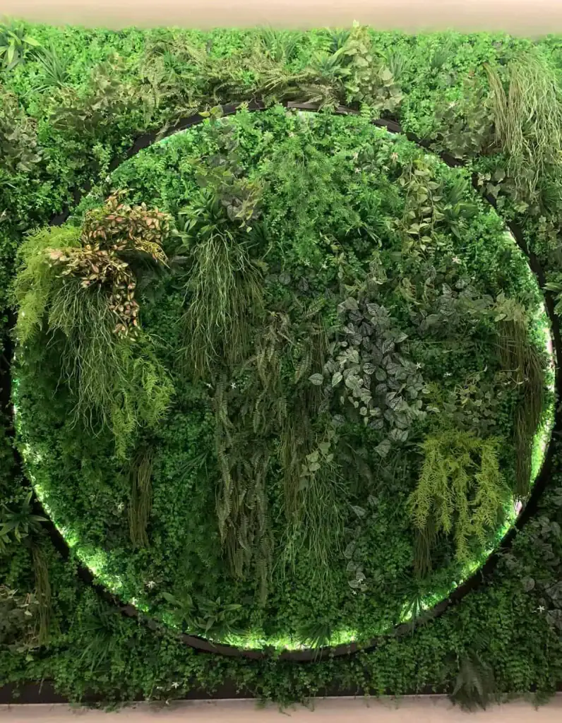 artificial living wall at Oxygen Manchester with circular light installation set within