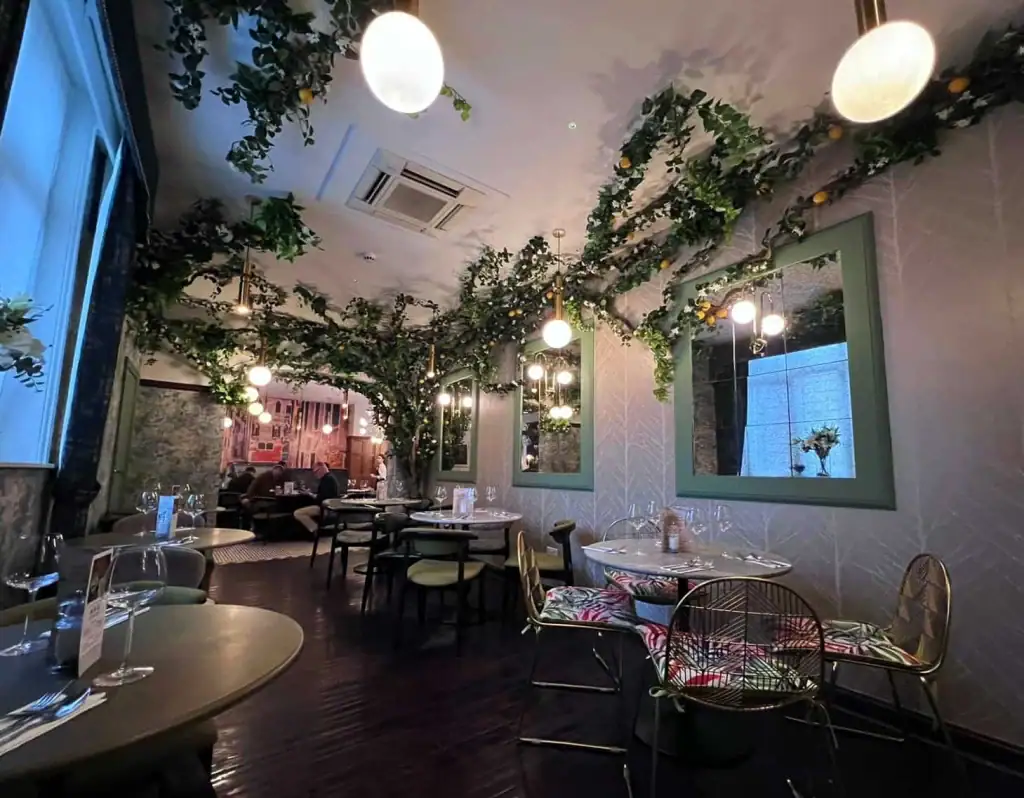 Ghostwood and curly wood trees dressed with vine, jasmine and lemons at Per Tutti