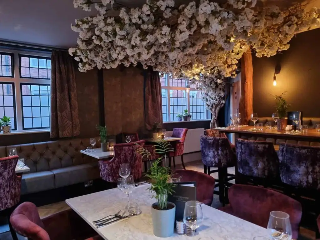 Sandblasted Ghostwood trunk, Manzanita branches and a profusion of pretty white blossom in Staffordshire Grill restaurant