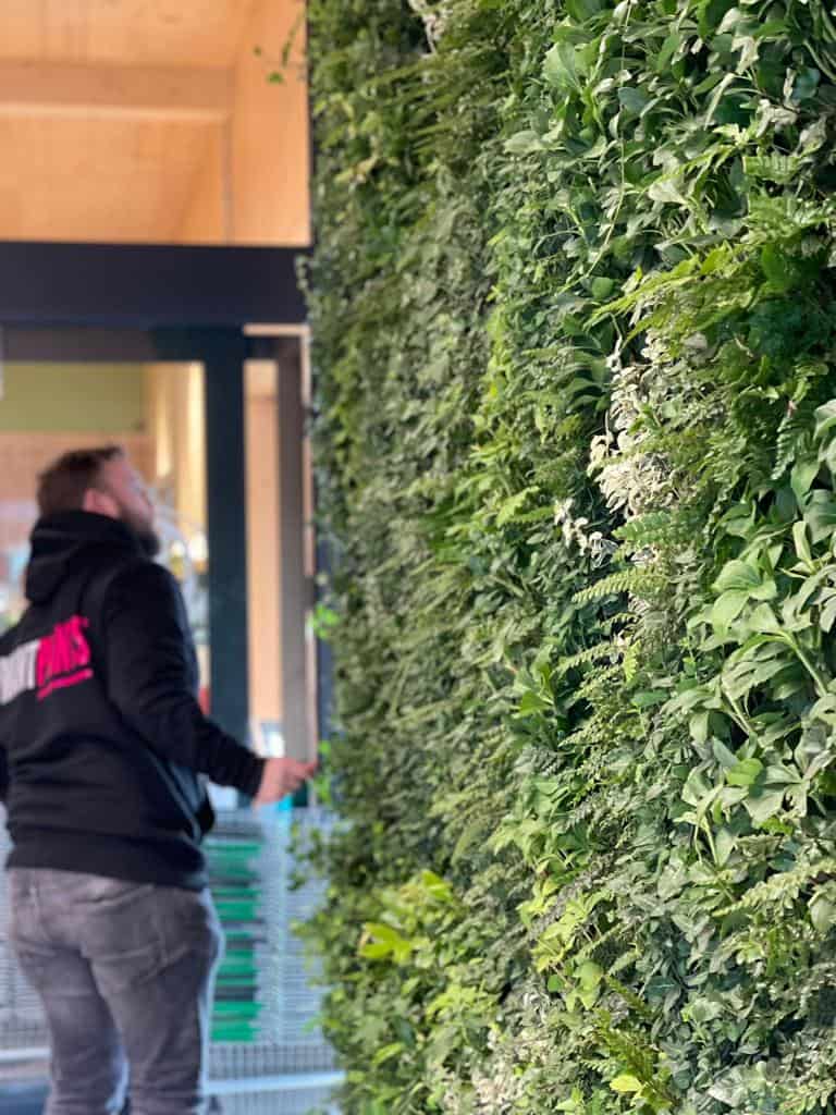 I Want Plants team installing bespoke living wall at Unicorn Grocery Store in Chorlton, Manchester