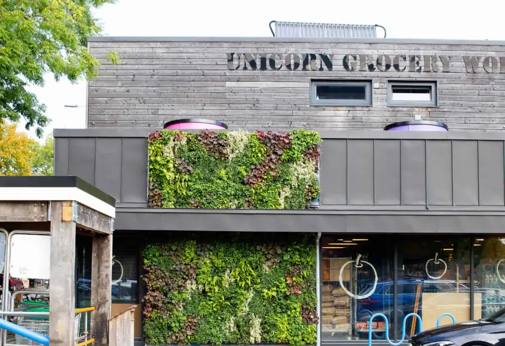 Worker-owned and run co-operative Unicorn Grocery Store's HYVERT living wall by I Want Plants
