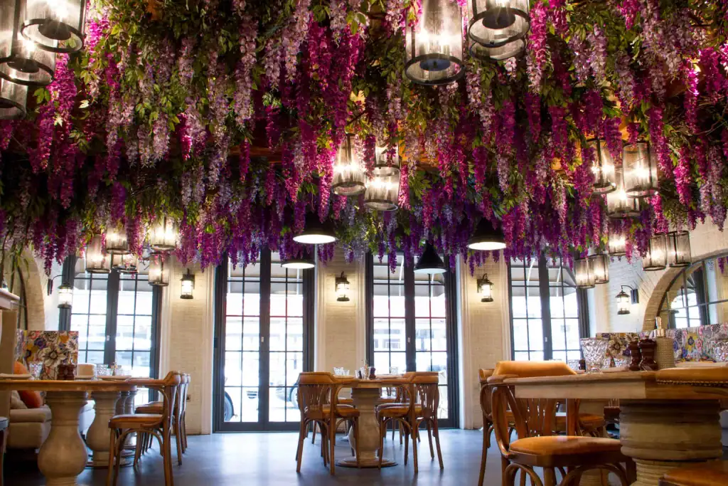 Various shades of wisteria spread across the ceiling at Victors