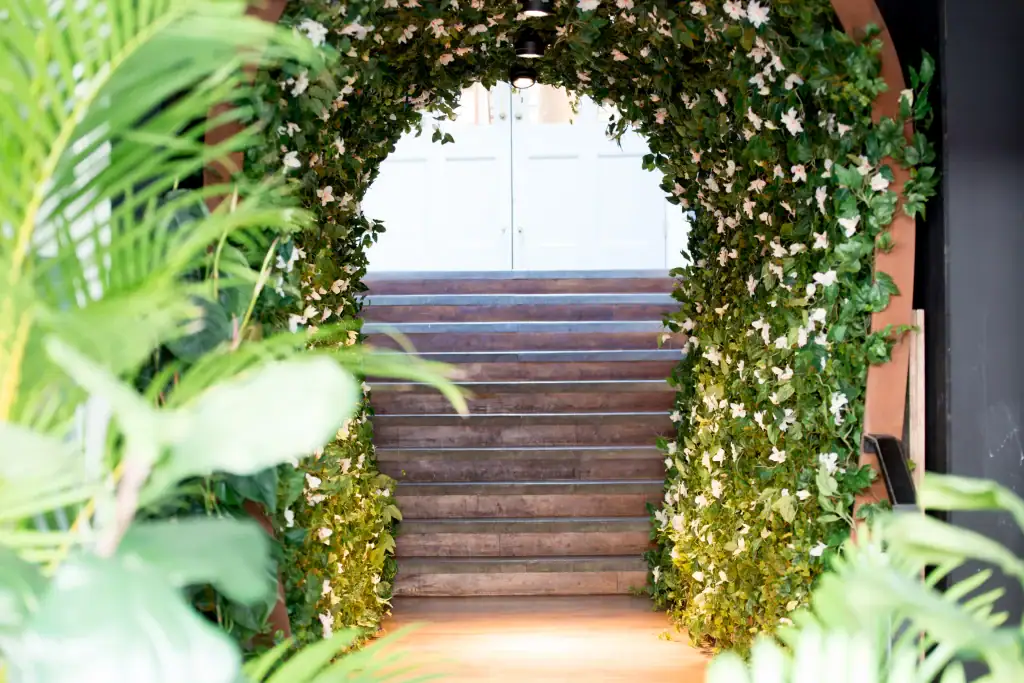 Artificial floral archway by I Want Plants