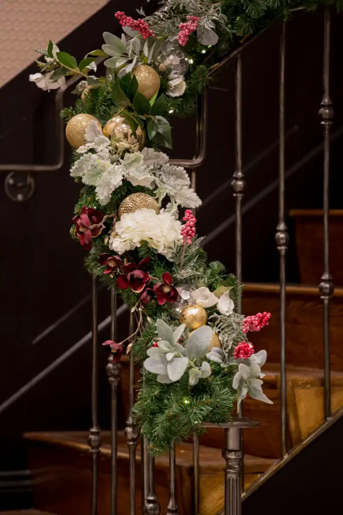 festive garland entwined around staircase
