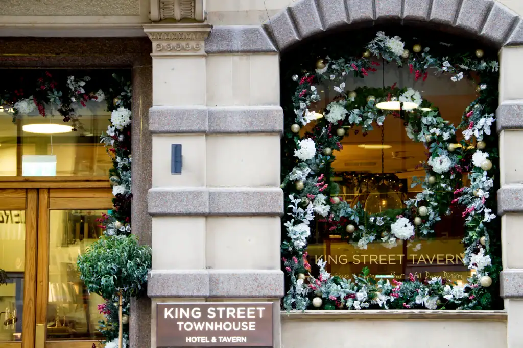King Street Townhouse hotel with festive wreath and garland to the exterior