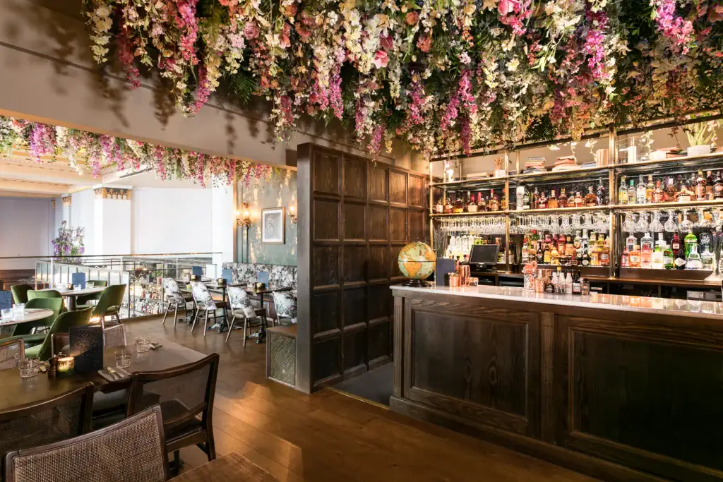 artificial flower display on ceiling by i want plants
