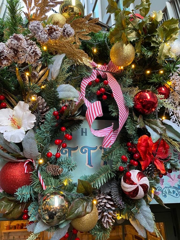 red white gold coloured festive decorations by I want plants