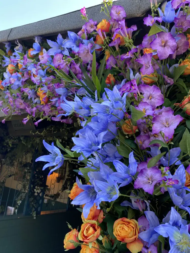 flight club cardiff artificial floral displays around wood huts