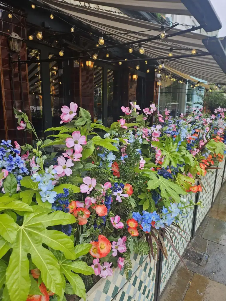 flight club artificial floral displays in client containers