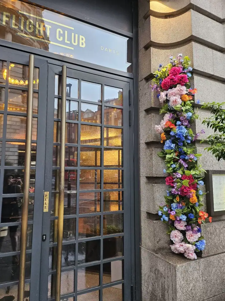 Flight Club artificial floral display next to entrance