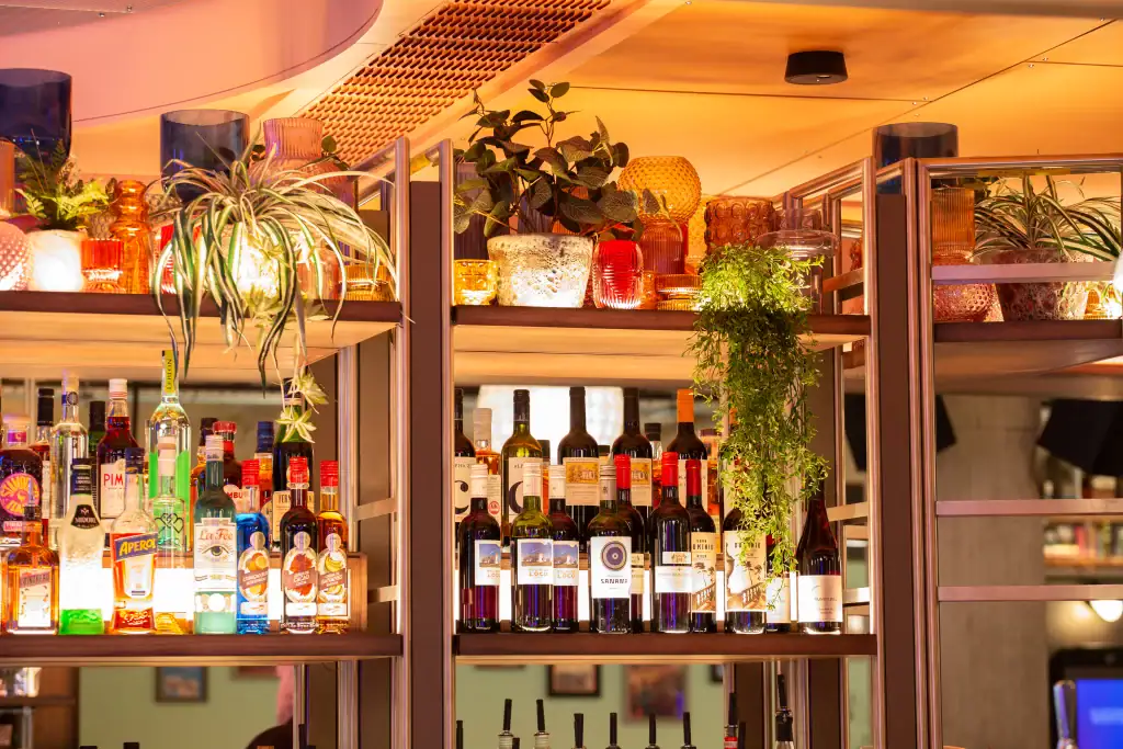 artificial plants on cocktail bar in electric shuffleby i want plants