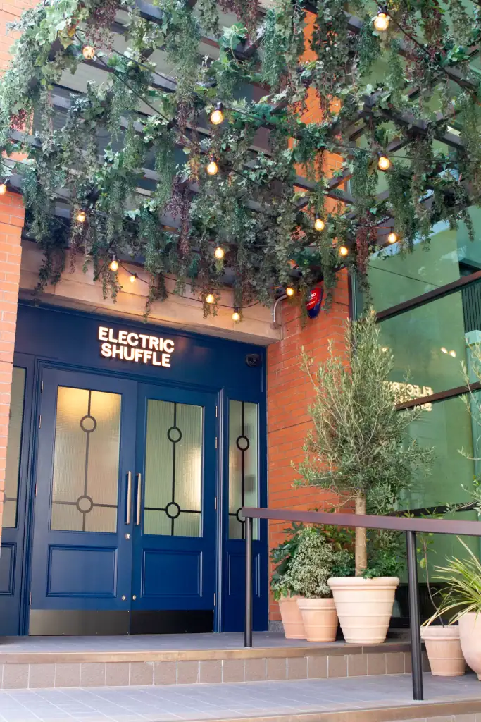 main entrance to electric shuffle manhester with artificial trailing plant raft by i want plants