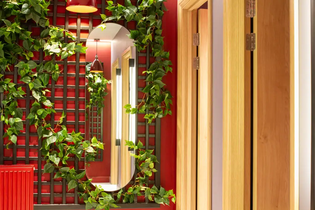 artificial vine from i want plants climbing up trellis in bathroom