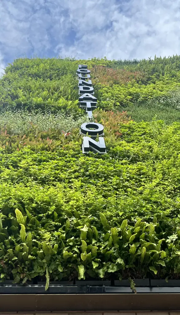close up of Foundation signage within HYVERT living wall