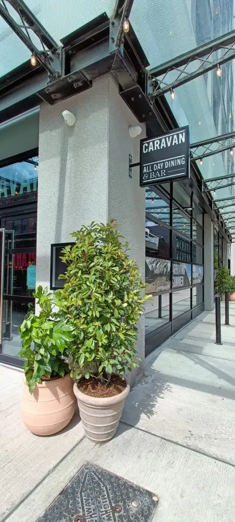 Caravan restaurant Manchester with live Photinia plant in containers outside entrance