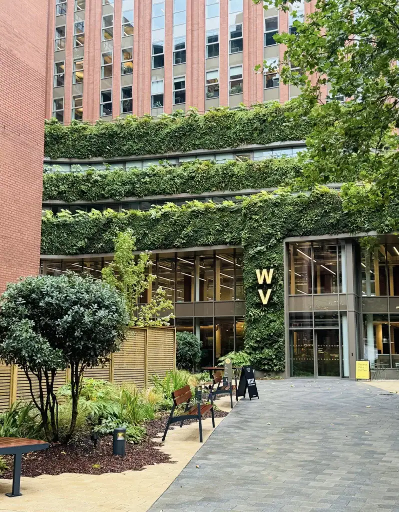 HYVERT living wall at West Village Leeds with building name sign inset