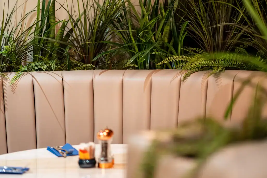 artificial grasses built into booth seating at stockton heath