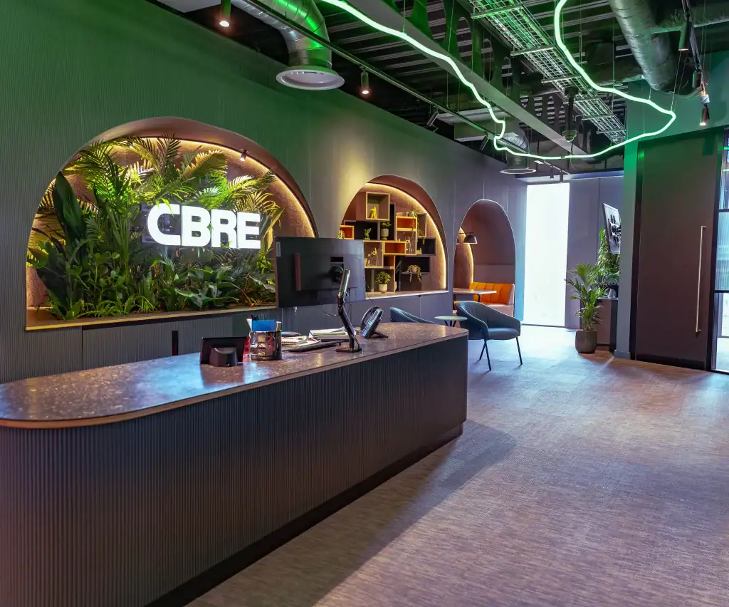 CBRE Liverpool Reception Area with artificial plant displays behind reception desk