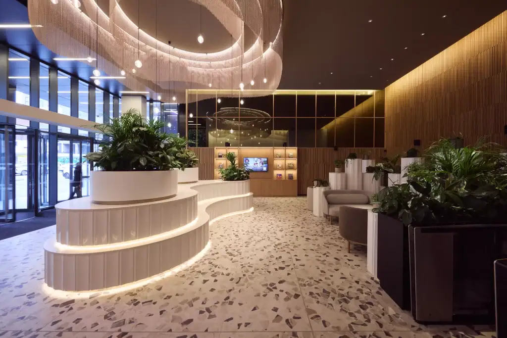 Centre City Communal Reception with live plants in circular built in troughs