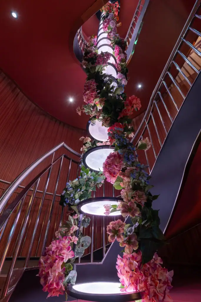 Clays bar helical light and artificial floral installation by I want plants